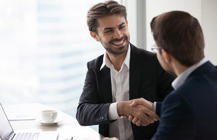 2 men completing real estaste transaction