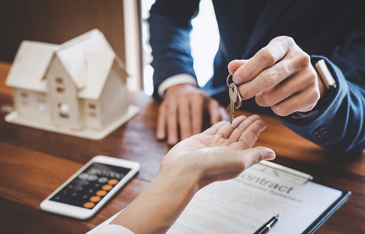 person getting keys to new real estate